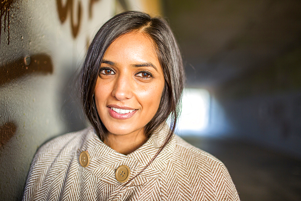 Portrait of smiling Indian woman in tunnel