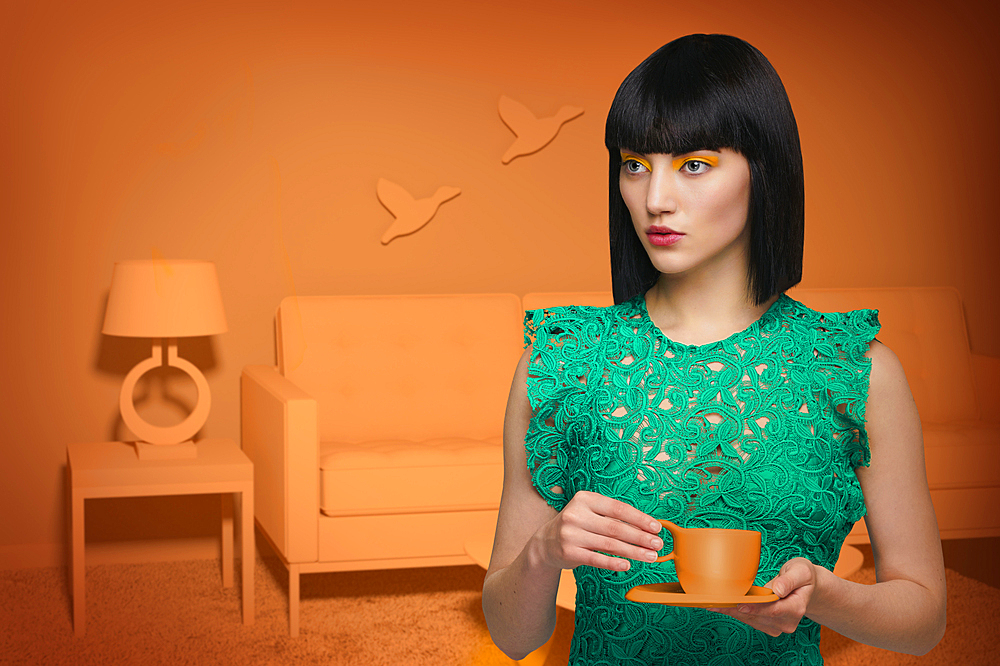 Caucasian woman in orange old-fashioned livingroom drinking coffee