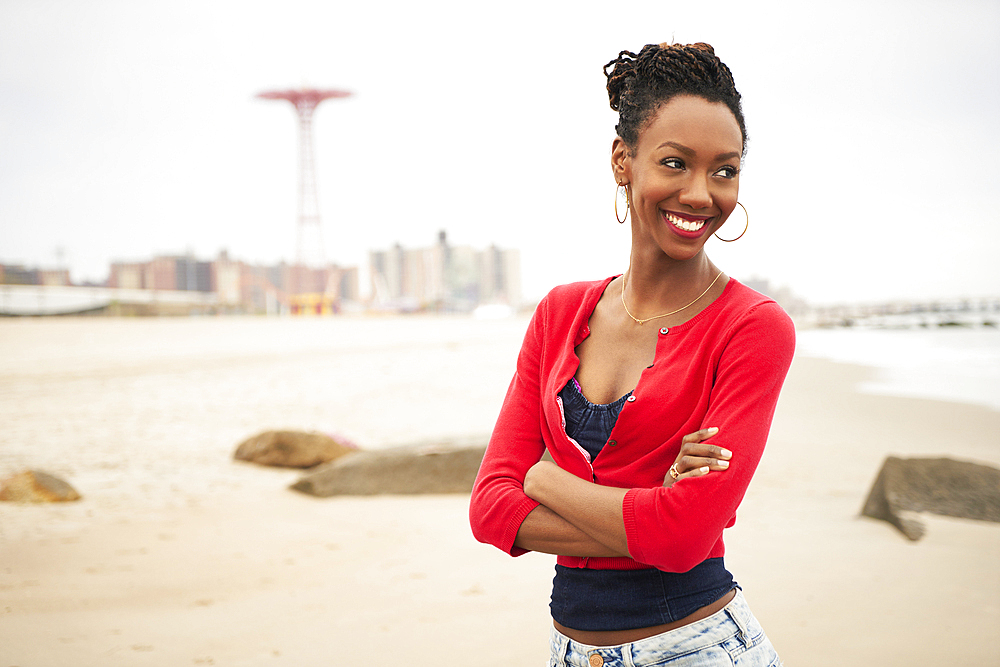 Black woman smiling on beach