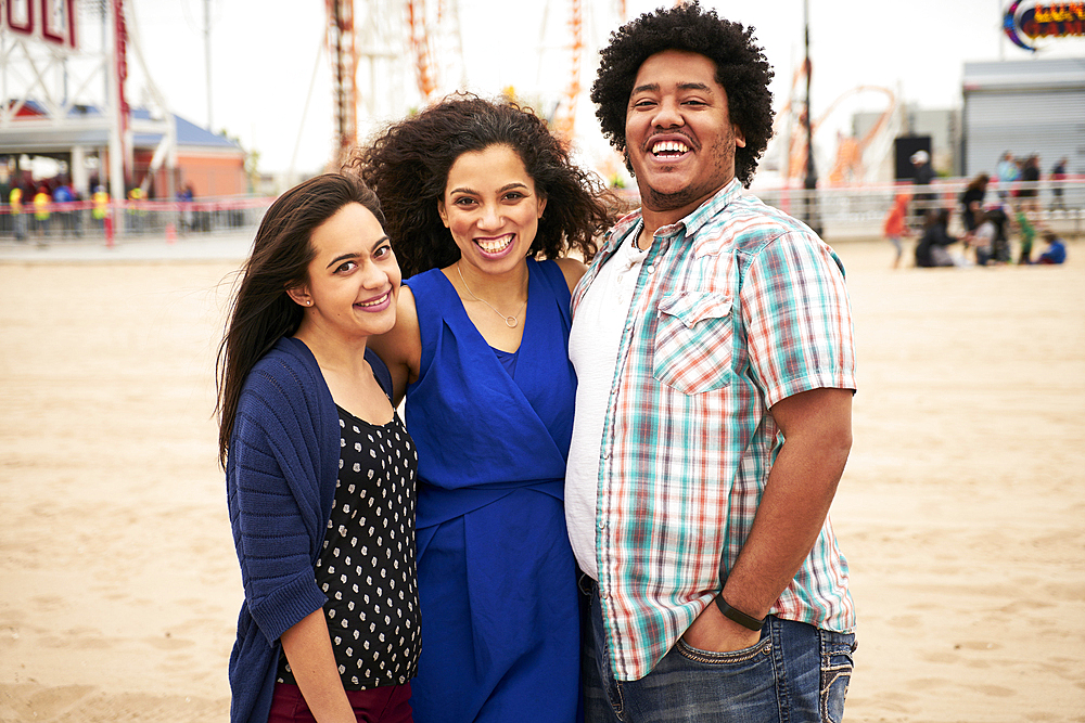 Friends standing on beach