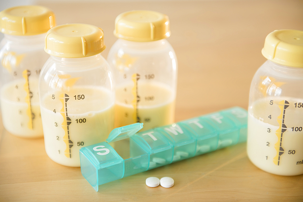 Pill box and bottles of breast milk