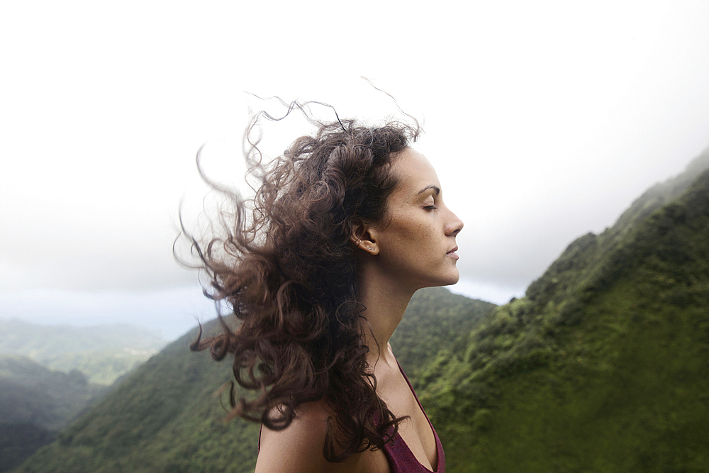 Wind blowing hair of Mixed Race woman