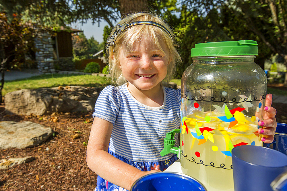 Smiling Caucasian girl posing with lemonade