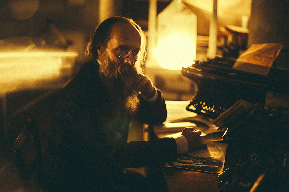 Caucasian man with beard reading book