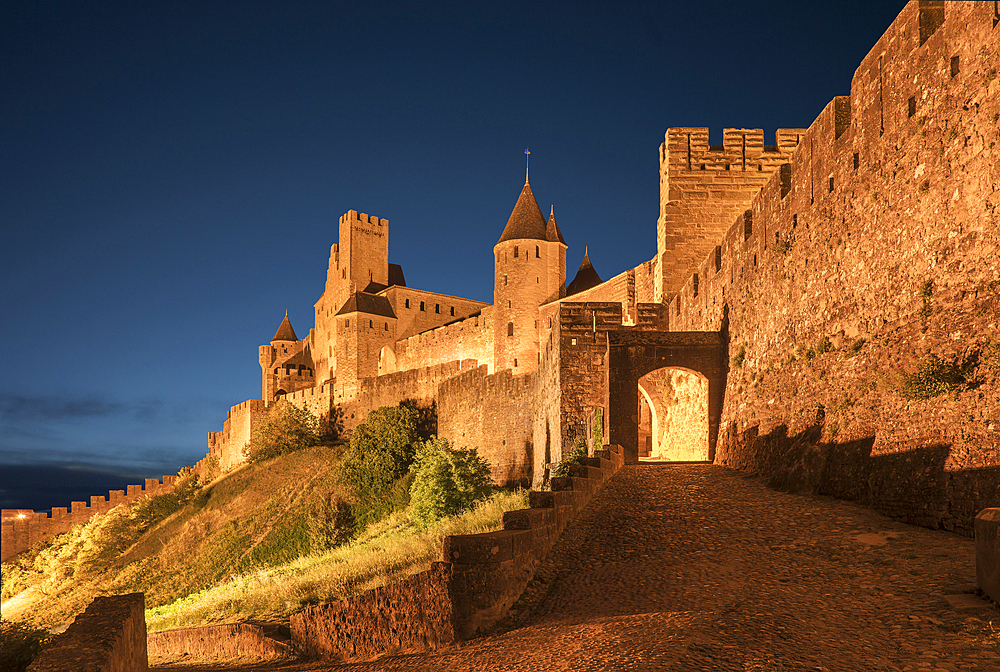 Road to castle at night in Carcassonne, Languedoc-Roussillon, France