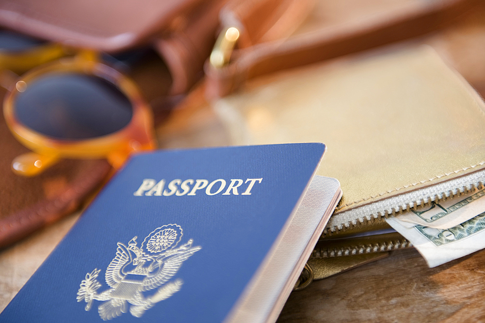 Passport, wallet and sunglasses