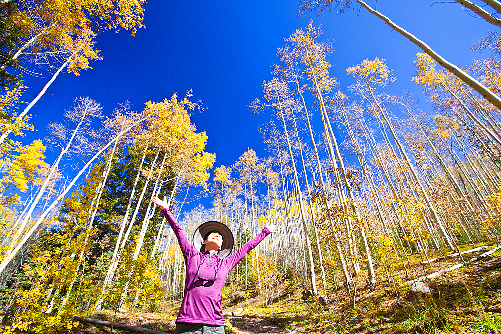 Japanese woman celebrating in forest