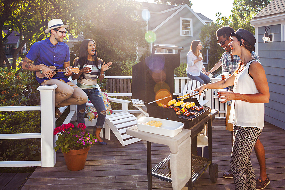 Friends enjoying barbecue on patio