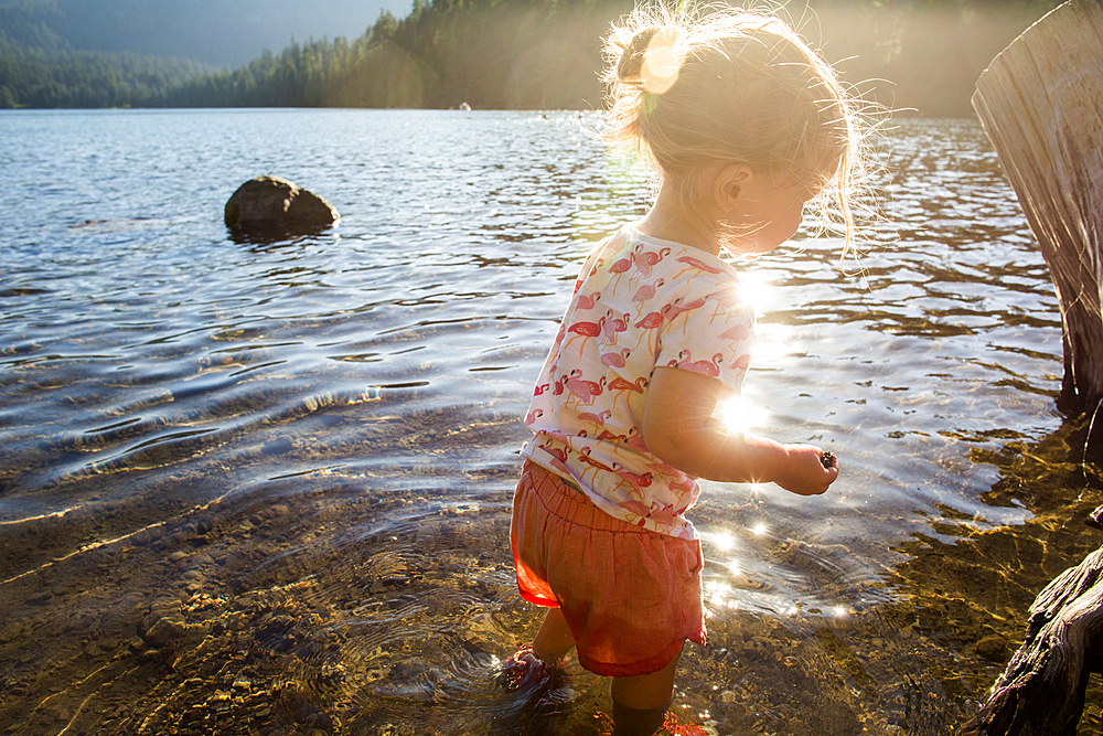 Caucasian wading in river