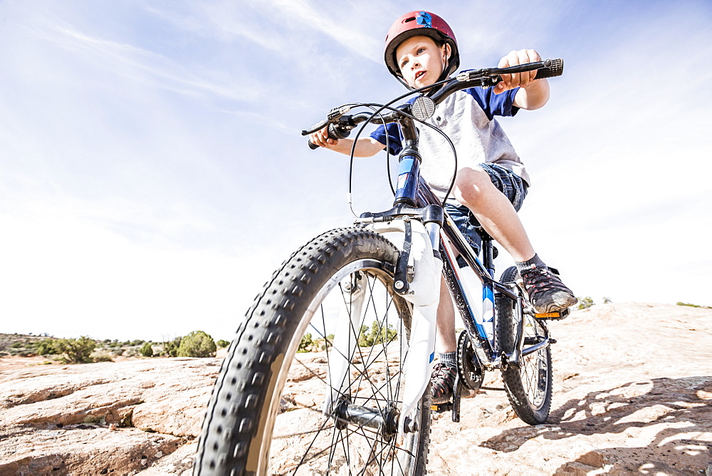 Caucasian boy riding mountain bike