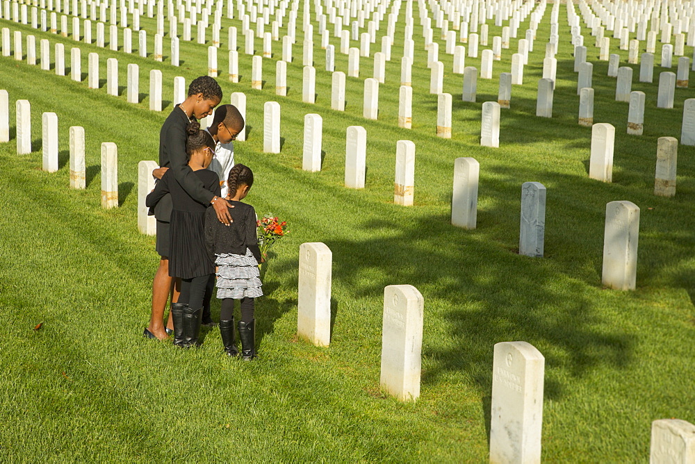 Black family at military cemetery