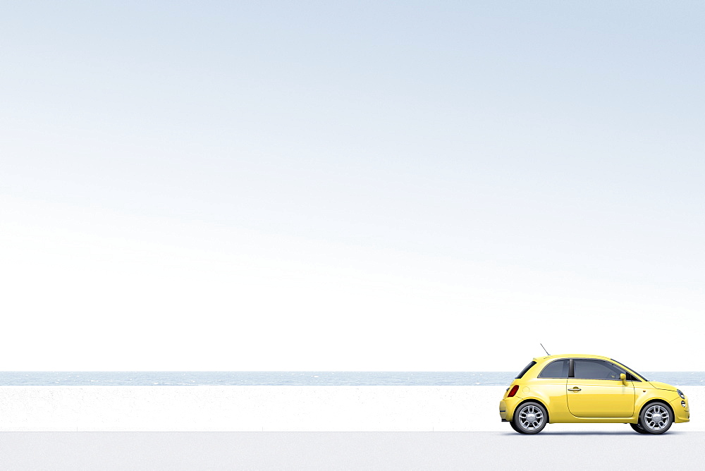 Yellow car near ocean