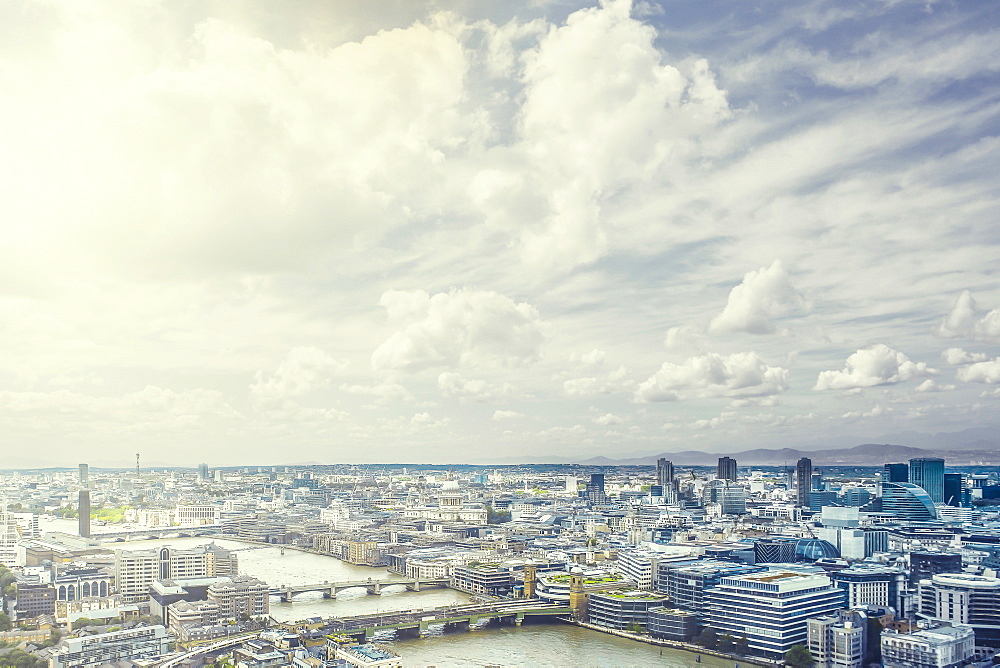 Clouds over river through city, London, England, United Kingdom,