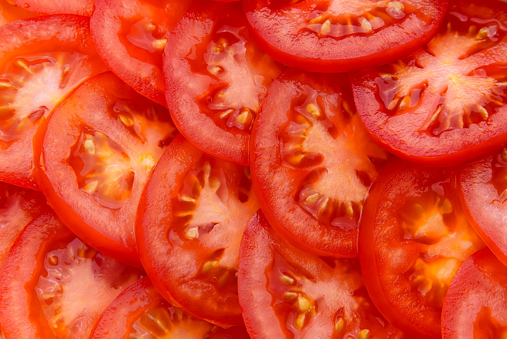 Pile of sliced red tomatoes