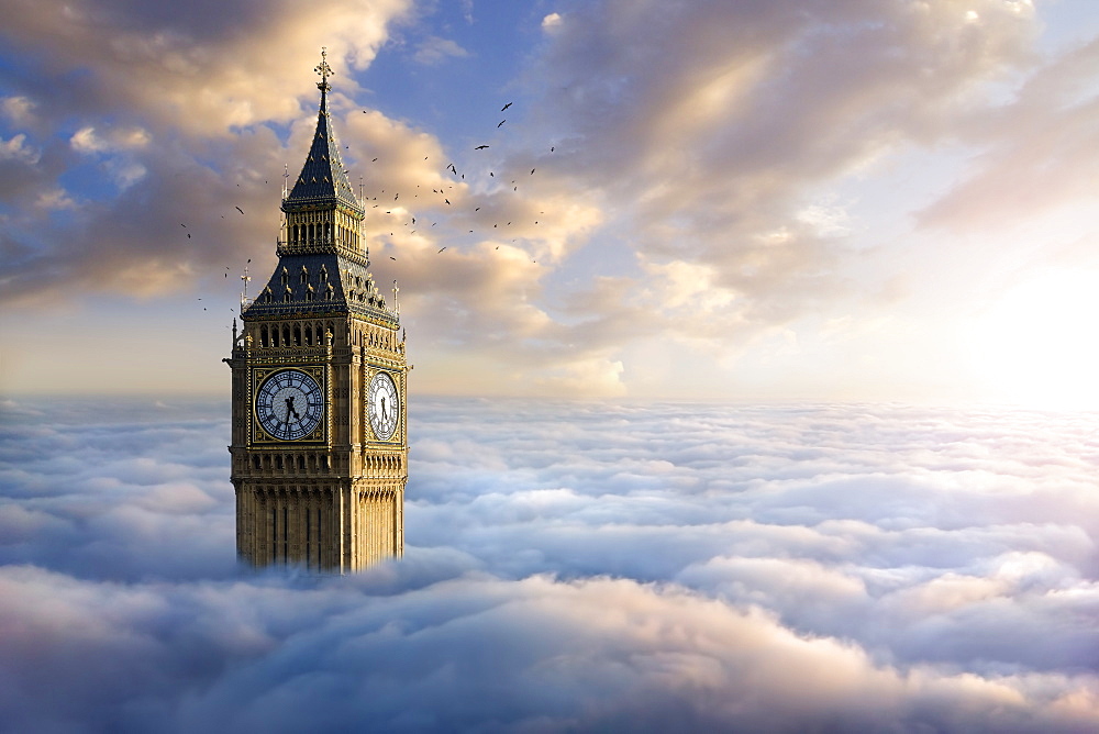 Birds flying around clock tower above clouds