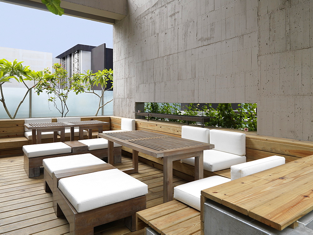 Outdoor patio with wooden furniture