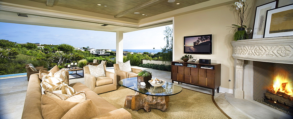 Contemporary living room with view of ocean, panoramic