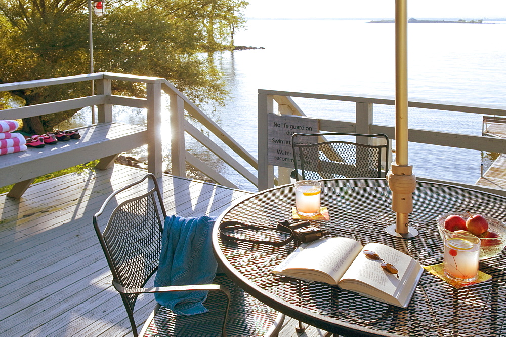 Patio table on deck by lake