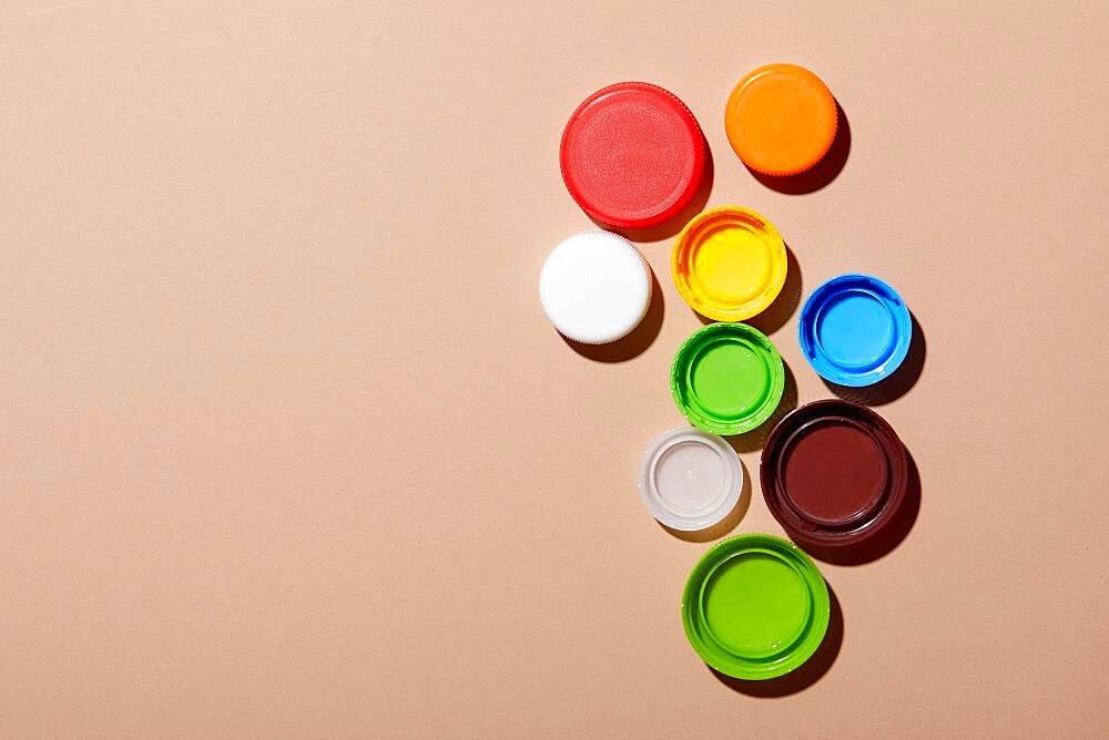 Overhead view of colorful bottle caps