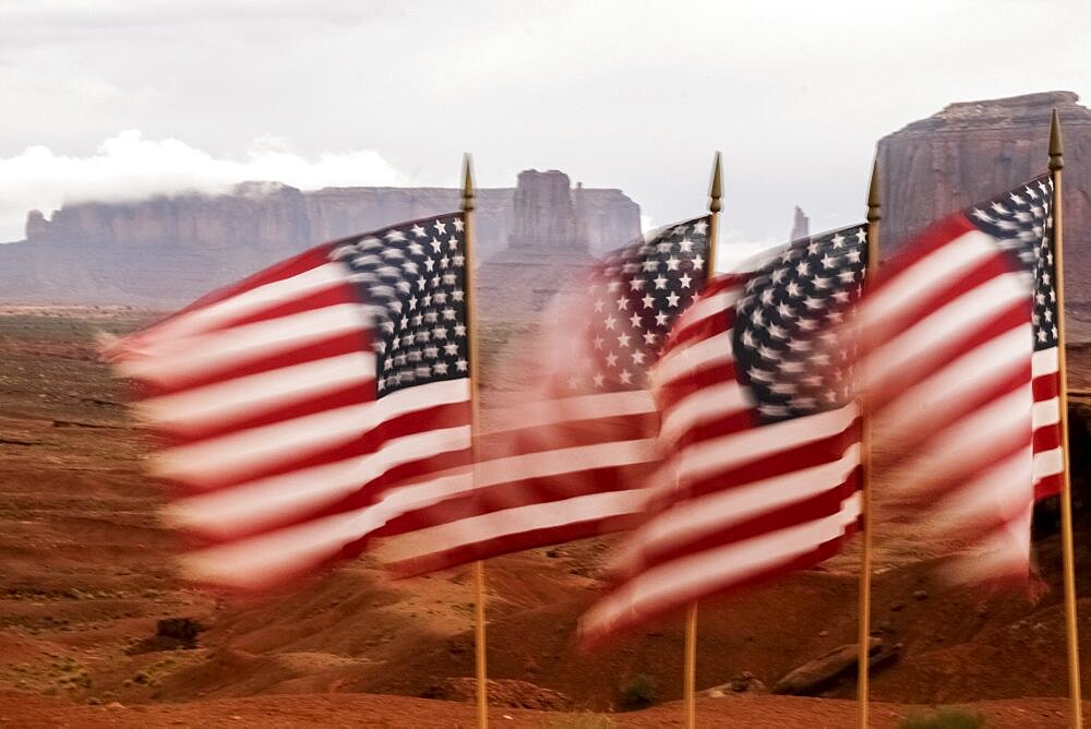 United States, Utah, Monument Valley, American flags blowing in wind