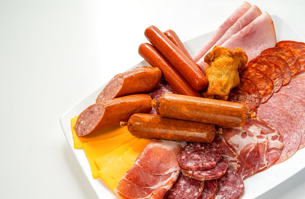 Assorted cold cuts, sausages and cheese on plate