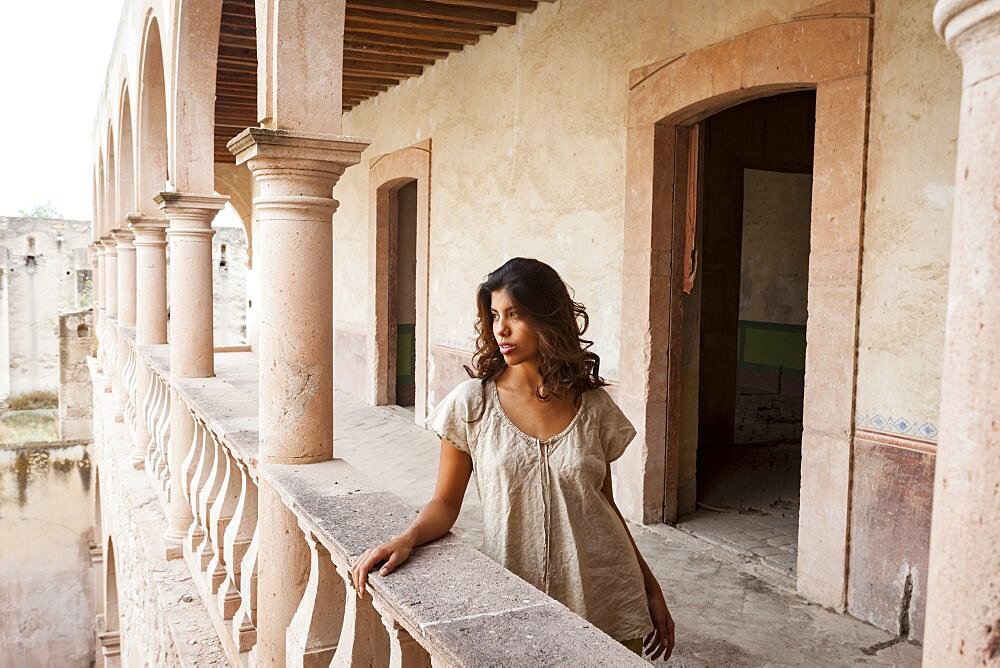 Mexico, San Felipe, Woman posing at old abandoned hacienda