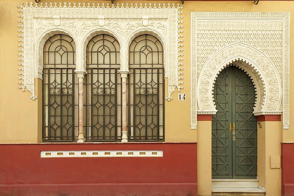 Spain, Seville, Moorish style building with arched entrance and windows 