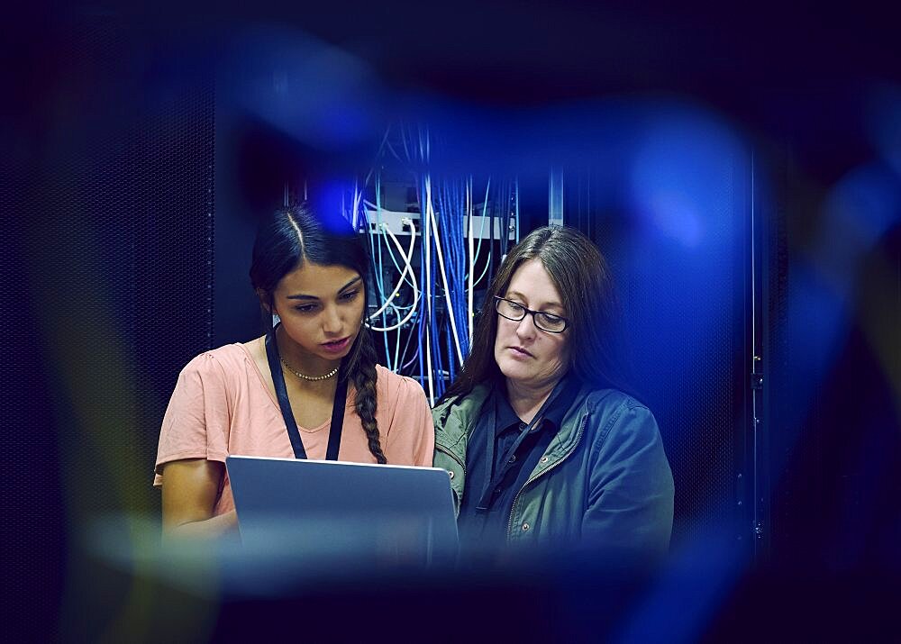 Female technicians working in server room