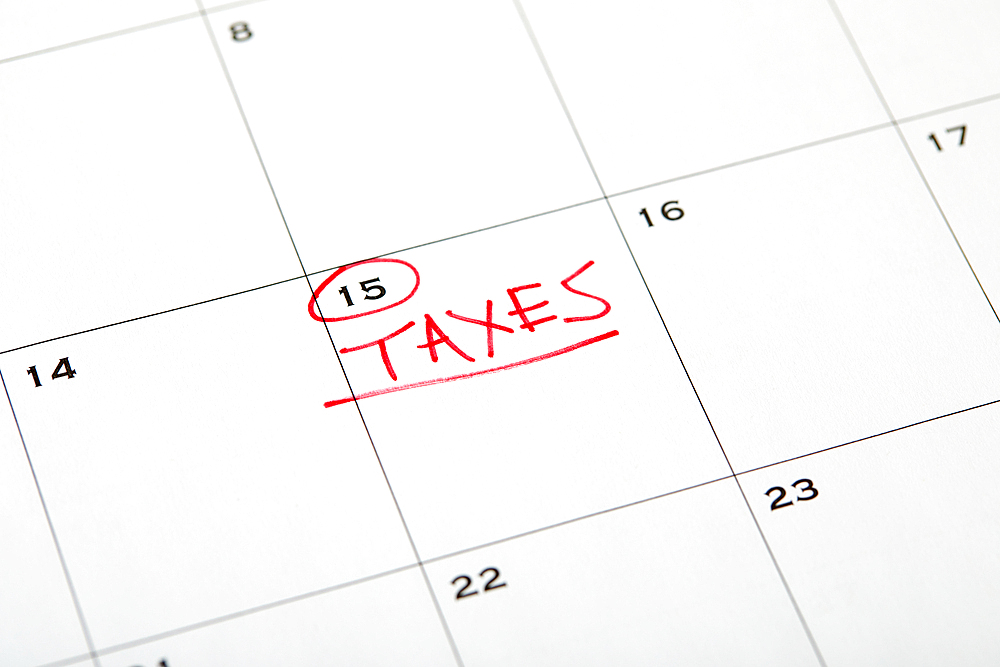 Tax day marked on wall calndar in red