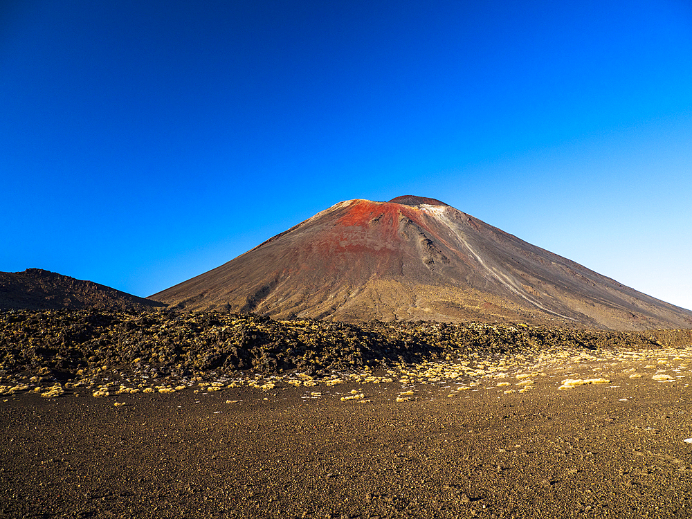 New Zealand, Waikato, Tongariro National Park, Mount Ngauruhoe volcano against blue sky