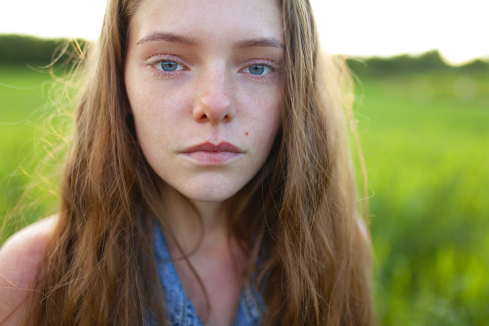 Portrait of woman standing in field