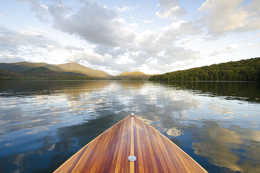 Boat on Lake Placid with Whiteface Mountain in distance