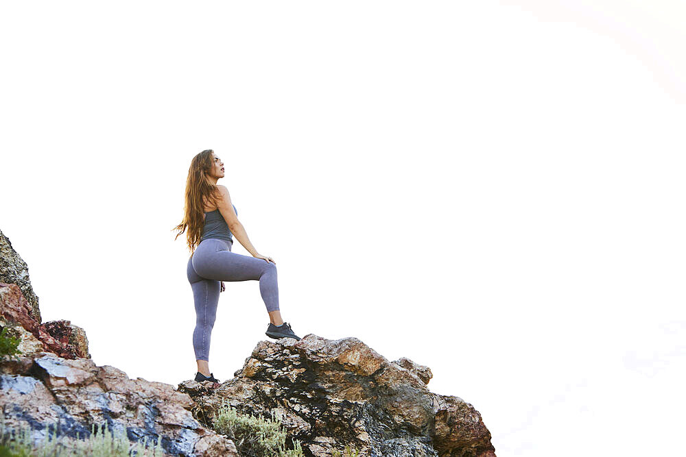 Mid adult woman hiking in mountains