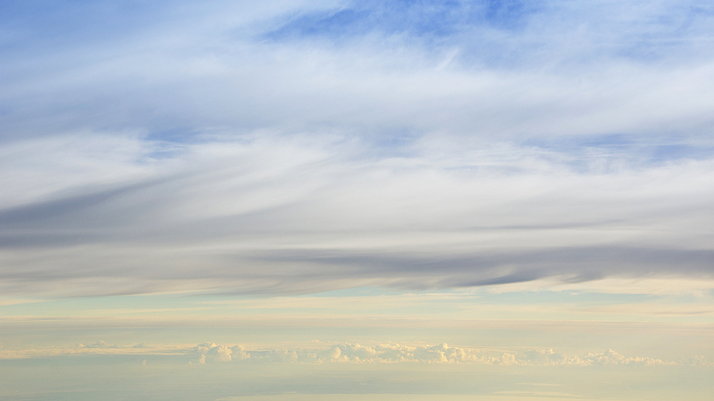 Layers of clouds from altitude 31,000 feet at sunrise