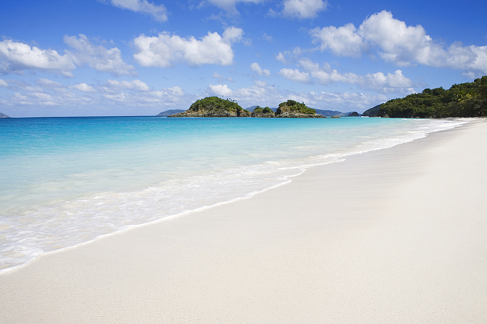 Calm sea waves on empty Trunk Bay Beach