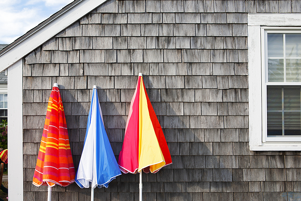 Folded beach umbrellas at beach cottage
