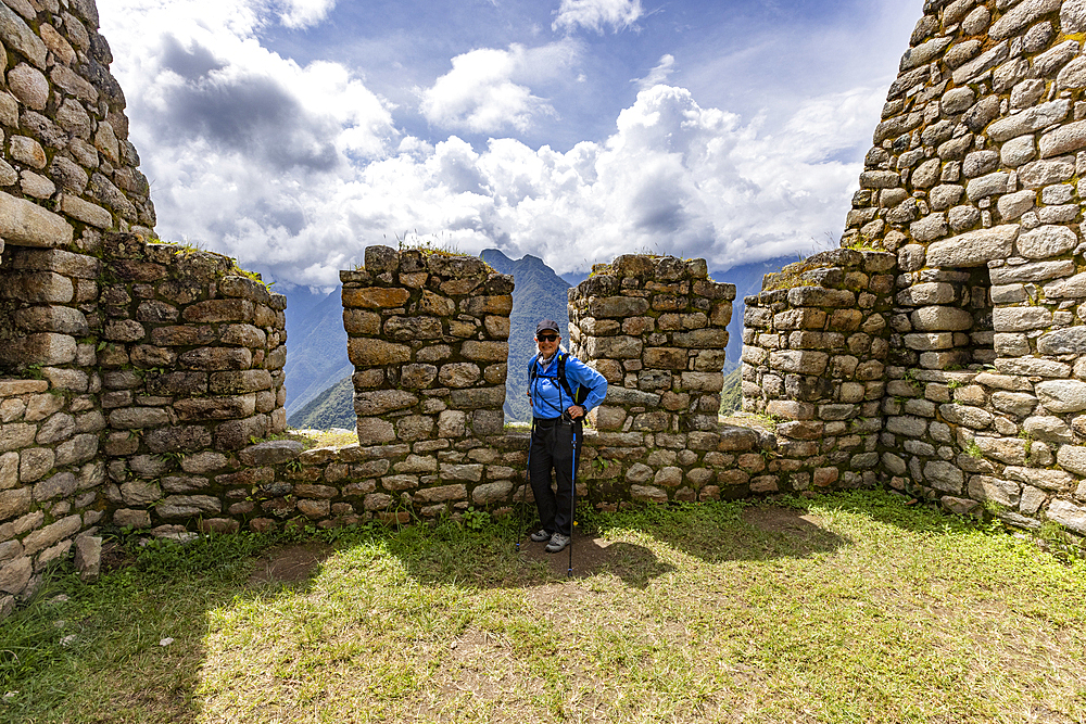 Portrait of smiling woman at Machu Picchu Inca ruins