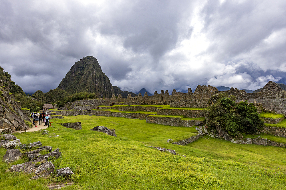 Storm clouds over Machu Picchu Inca ruins and mountains
