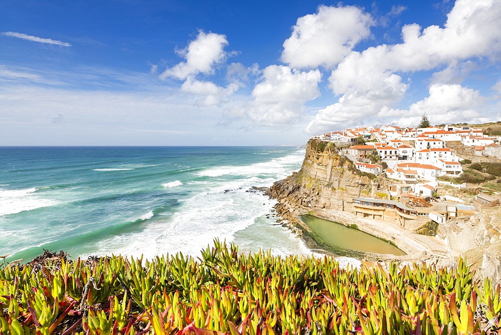 Top view of the perched village of Azenhas do Mar surrounded by the Atlantic Ocean and green vegetation, Sintra, Portugal, Europe