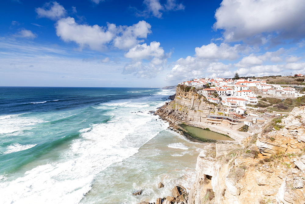 Top view of the perched village of Azenhas do Mar surrounded by the crashing waves of the Atlantic Ocean, Sintra, Portugal, Europe