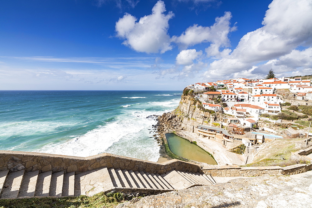 Top view of the perched village of Azenhas do Mar surrounded by the crashing waves of the Atlantic Ocean, Sintra, Portugal, Europe