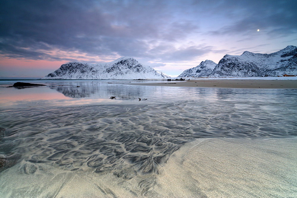 Black sand and full moon as surreal scenery at Skagsanden beach, Flakstad, Nordland county, Lofoten Islands, Arctic, Norway, Scandinavia, Europe