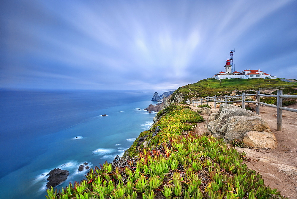 Sunrise on the cape and lighthouse of Cabo da Roca overlooking the Atlantic Ocean, Sintra, Portugal, Europe