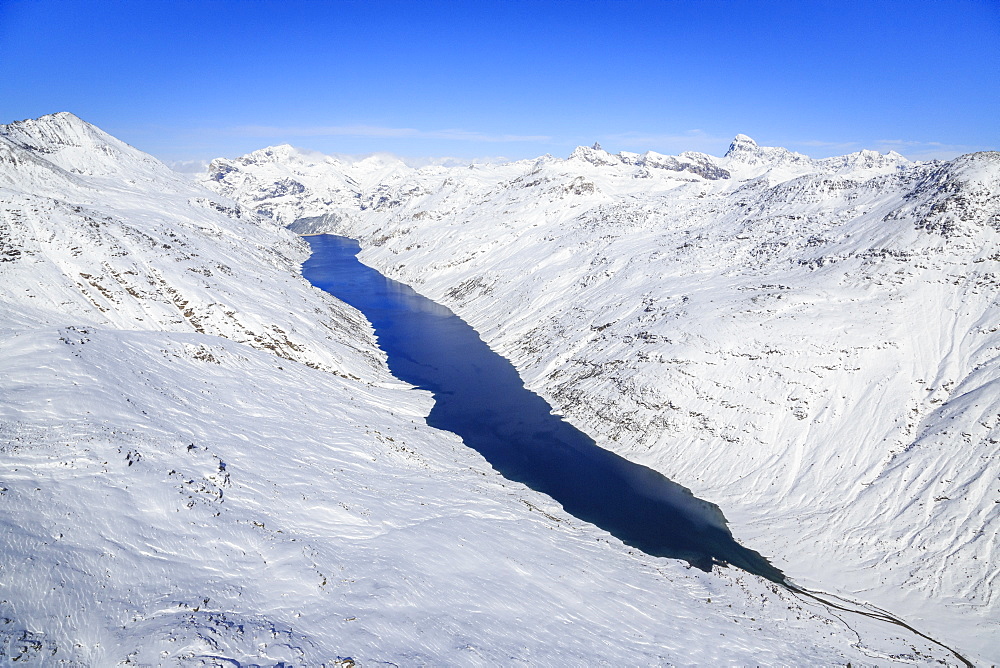 Aerial view of the alpine Lago di Lei surrounded by snow, Val di Lei, Chiavenna, Spluga Valley, Valtellina, Lombardy, Italy, Europe