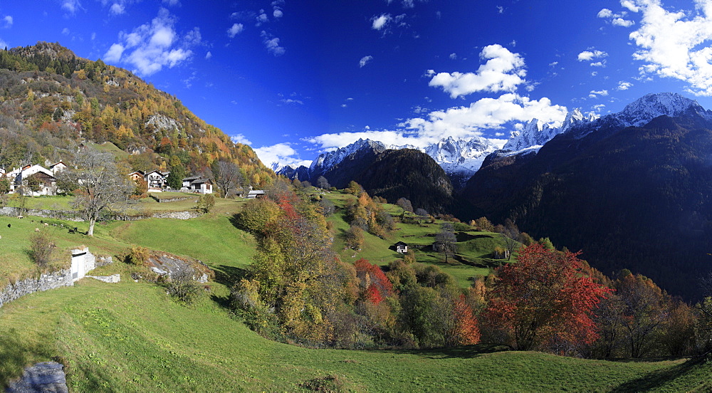 Panorama of the village of Soglio surrounded by colorful woods, Bregaglia Valley, Canton of Graubunden, Switzerland, Europe