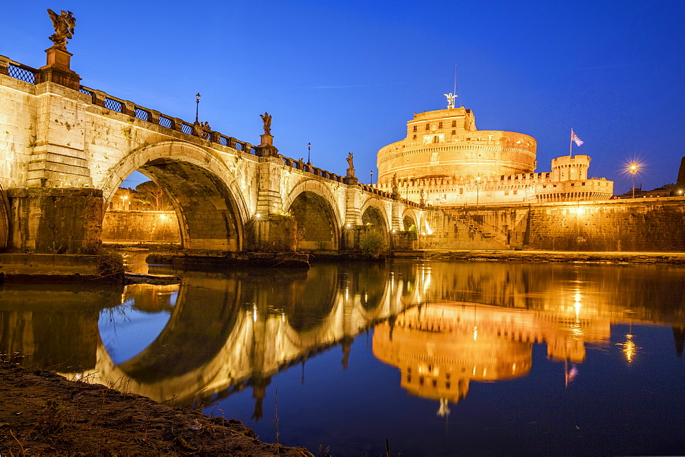 Dusk on the ancient palace of Castel Sant'Angelo with statues of angels on the bridge on Tiber RIver, UNESCO World Heritage Site, Rome, Lazio, Italy, Europe