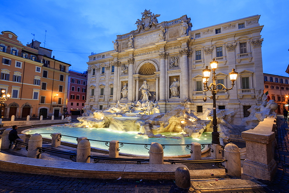 View of Trevi Fountain illuminated by street lamps and the lights of dusk, Rome, Lazio, Italy, Europe