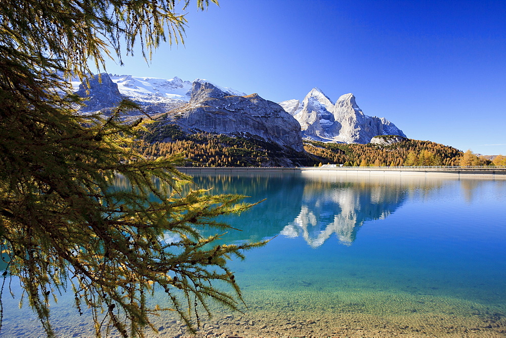 The majestic Marmolada Group and the Lake Fedaia with its turquoise waters, Dolomites, Italy, Europe