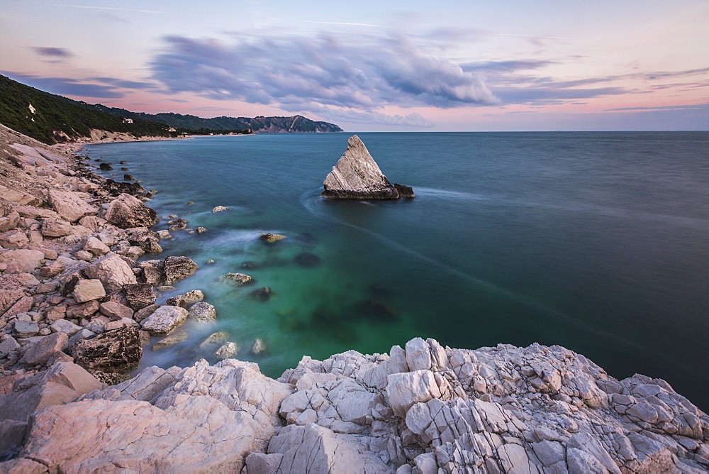 White cliffs frame the turquoise sea at sunrise, La Vela Beach, Portonovo, province of Ancona, Conero Riviera, Marche, Italy, Europe