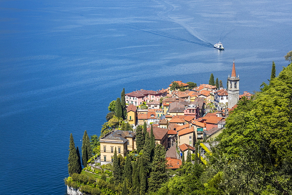 The typical village of Varenna surrounded by the blue water of Lake Como and gardens, Province of Lecco, Italian Lakes, Lombardy, Italy, Europe